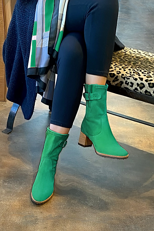 Emerald green women's ankle boots with buckles on the sides. Round toe. Medium block heels. Worn view - Florence KOOIJMAN